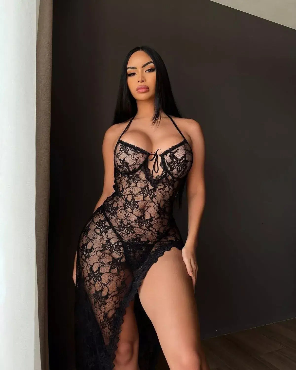 slips into lace dress with G-string bottom – and fans are speechless